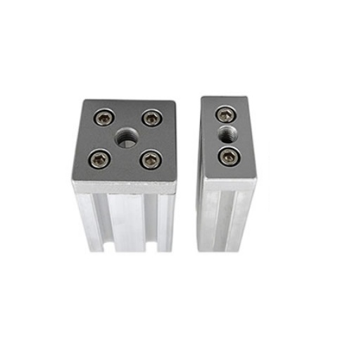 Unión para perfil de aluminio 4040 con anclaje para pata o rueda. M6. Gris